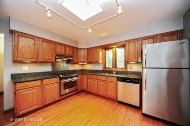 Updated Kitchen has a skylight and breakfast bar o