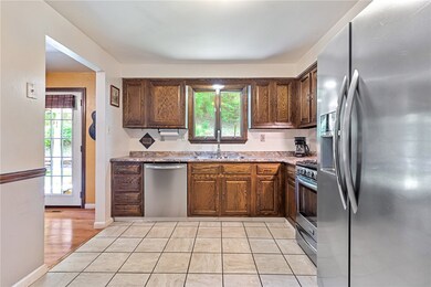 The kitchen features newer appliances and countert