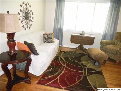 LIVING FEATURES BEAUTIFUL HARDWOOD FLOORS & LOTS O