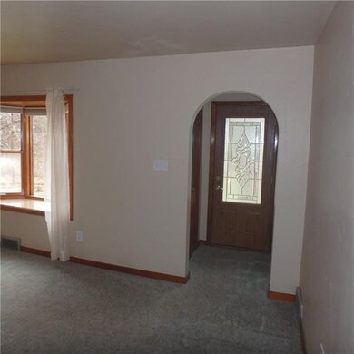 The front entrance opens into the living room and 
