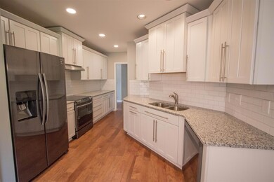 Remodeled kitchen with nice upgrades, including black stainless steel appliances.