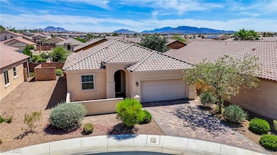 View of front of house with a garage, stucco sidin