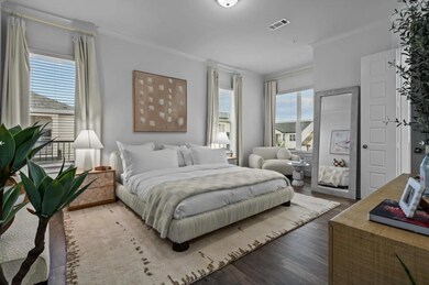 Bedroom with ornamental molding and wood finished