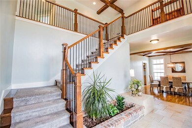 Open and beautiful entryway. Freshly painted and new carpet.