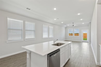 Kitchen with stainless steel dishwasher, a ceilin