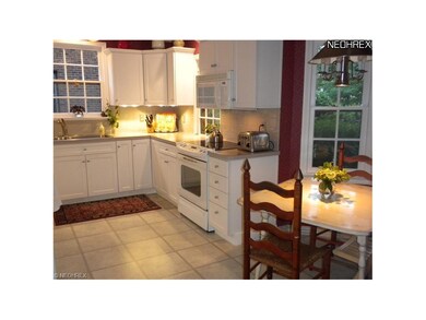 The updated kitchen boast newer, white (maple) cab