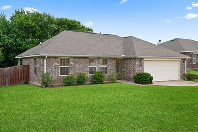 The home's charming façade and manicured landscapi