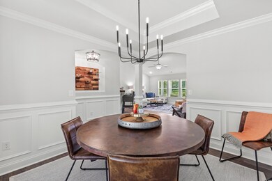 Dining space with ornamental molding, decorative c