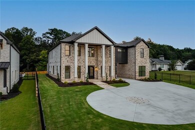 Neoclassical / greek revival house featuring brick siding and board and batten siding