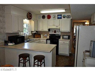Exterior Front. The kitchen has an eat-at bar along with great cabinet and counter space.