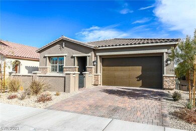 Features courtyard, stone exterior, paver driveway
