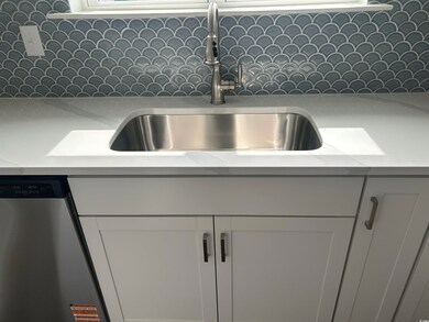 Interior details featuring stainless steel dishwas