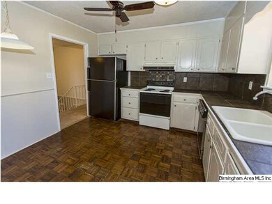 Nice, bright kitchen with parquet floor, tile back