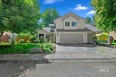 View of front of property with an attached garage, concrete driveway, a shingled roof, and brick siding