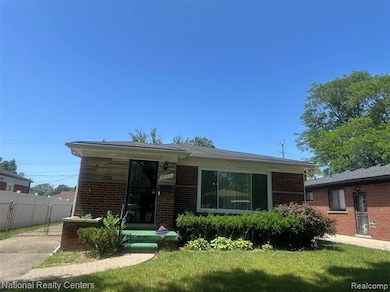 Rear view of house featuring brick siding