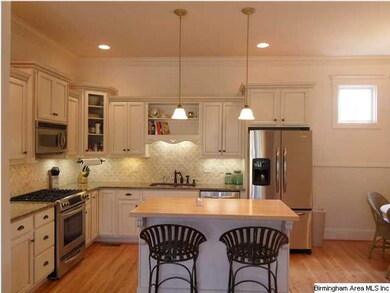 Light and bright eat-in kitchen with gas range and