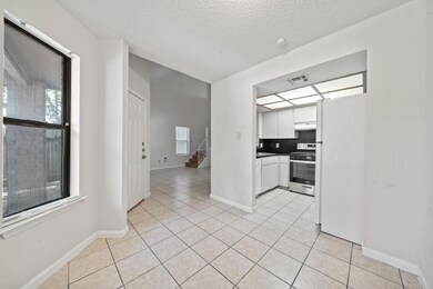 Kitchen featuring gas stove, freestanding refrige