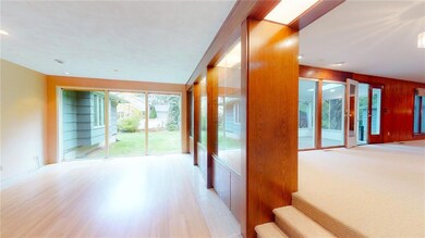 Fabulous sunken living room with a wall of glass, 
