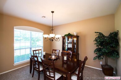 The spacious formal dining room offers a neutral t