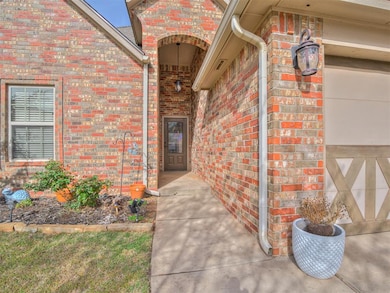 View of exterior entry with brick siding