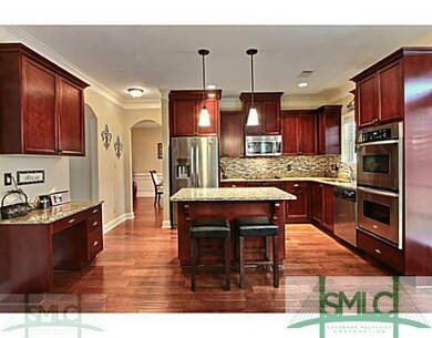 Kitchen. Built In Desk, Tile Backsplash, Wood Floo