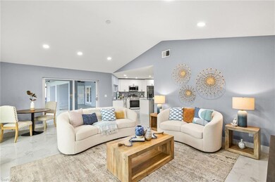 Living area with light marble finish floors, lofte