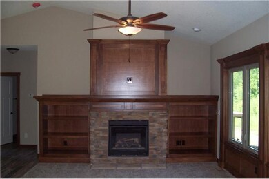Living Room. Alder wwod bookcases with stone firep