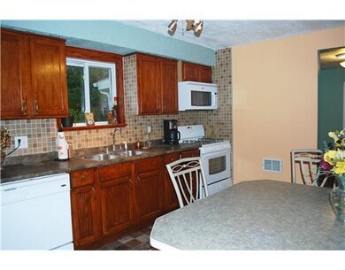 Kitchen. Opens to living room and hallway back to 