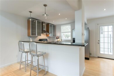 The soft contemporary design carries into the kitc