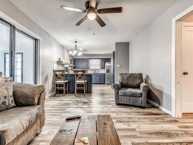 Living room with light hardwood / wood-style floor