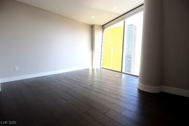 Spare room with dark wood-style flooring