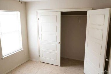 Unfurnished bedroom featuring a closet and light tile patterned floors