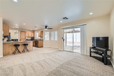 Kitchen with a ceiling fan, freestanding refrigera
