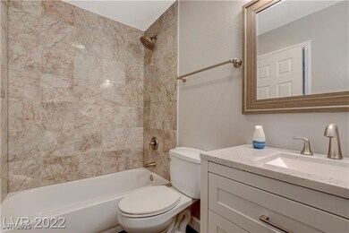 Bathroom featuring vanity and shower / bathtub com