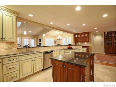 Kitchen also opens to the family room as well as t