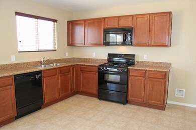 Open Kitchen with Rich Wood Cabinets