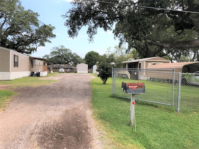 Fully-fenced mobile home park with 10 homes one on