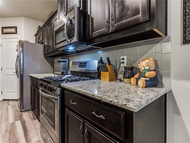 Kitchen:  A corner built-in pantry, oven, and micr