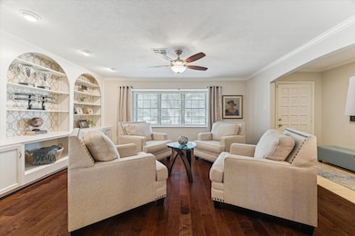 Living Room showcases beautiful built-ins and window seat style bay window.