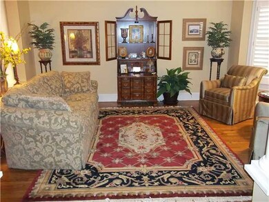 Living room with a bay window, Hardwood floors and