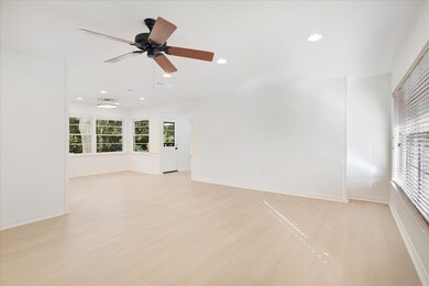 Living room featuring light wood-style floors, recessed lighting, and ceiling fan