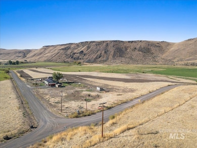 View of mountain backdrop featuring rural landscape