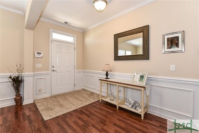 Nice entrance with wainscoting and beautiful wood 
