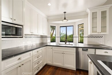 Gleaming white cabinets with pull out shelving