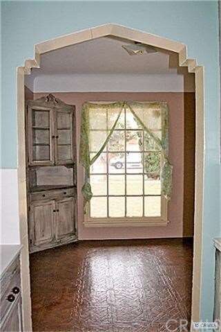 Large formal breakfast room with custom arched doo