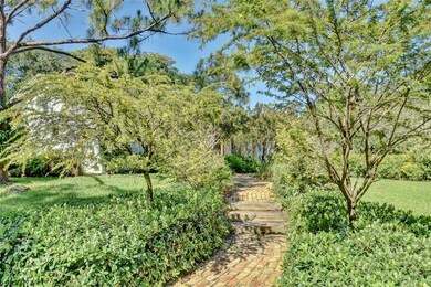 Beautiful walk way with flowering trees and butter