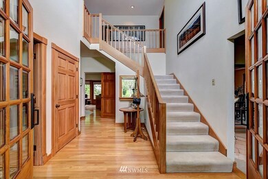 Vaulted ceilings, french doors and stunning wood wrapped doors and windows!