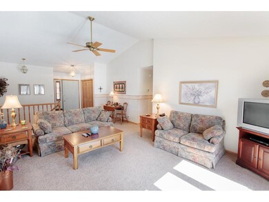 Another view of the living room and entry way.