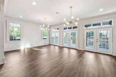 Rear living room with 3 sets of French Doors