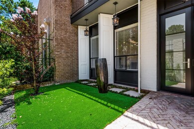 Front exterior has a quaint, courtyard-like entry